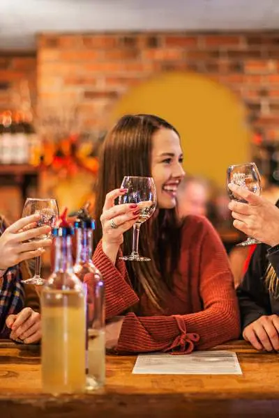 Three woman drinking wine together 